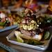The Wurst Bar's speciality burger starts with a 7oz. ground flank patty and is topped with carnitas made of braised pork shoulder, marinated in hard cider and orange juice and pulled and then deep friend, a chilaquiles made with Frito corn chips, roasted tomatillo salsa verde, and egg and queso fresco, cilantro and lime all on top of telera bread. Melanie Maxwell | AnnArbor.com  


